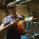 Water Blaster Drum Magazine 800 Round Orange 950015 Lifestyle Indoors Drum being Loaded into SRB1200